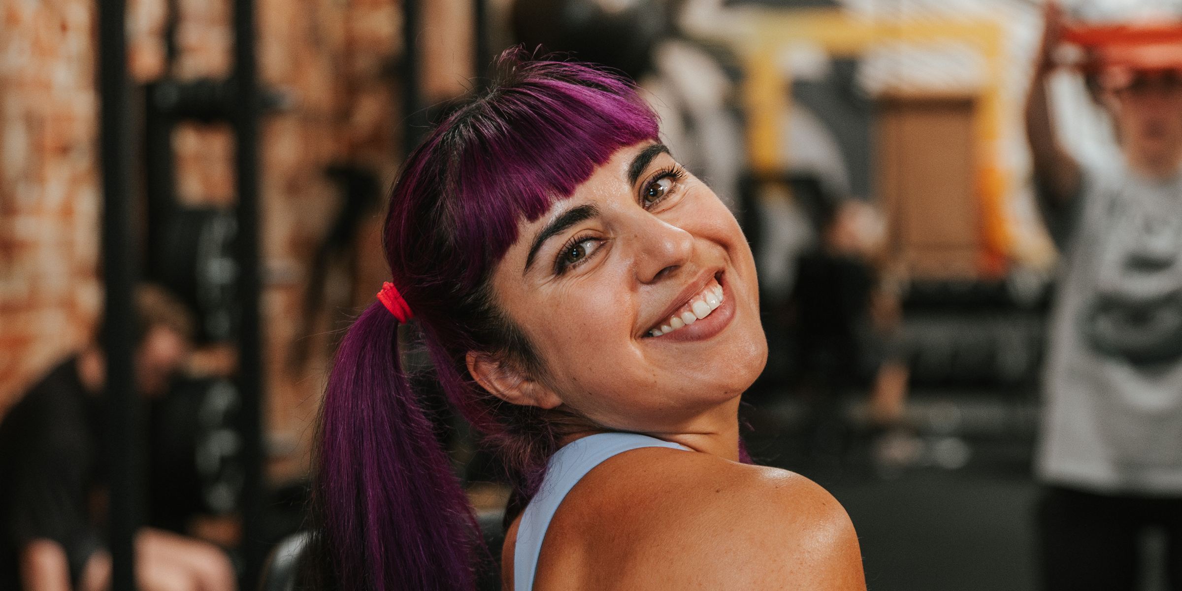 Romina smiling in the gym